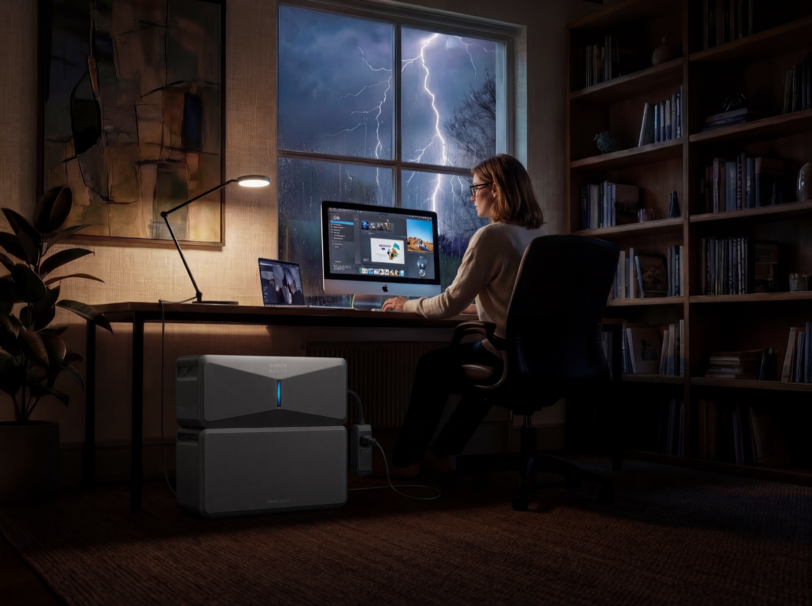 Woman working at a home desk during a thunderstorm
