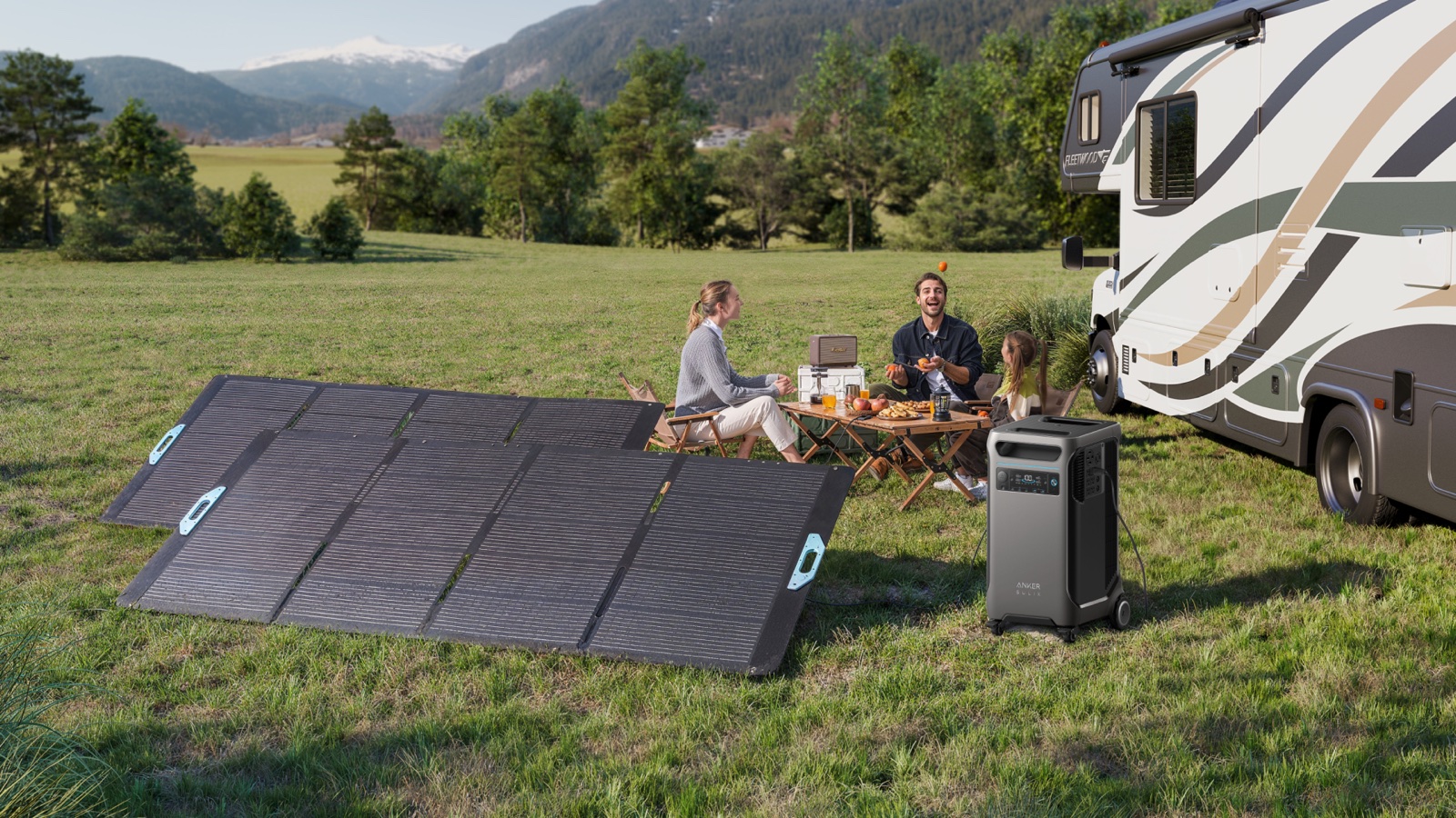 Family seated outside a motorhome with a folding solar panel
