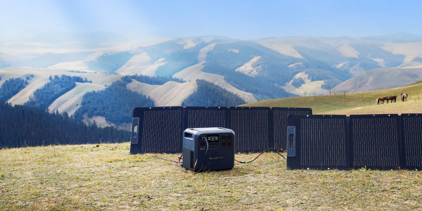 Power station and folding solar panels on an open hillside
