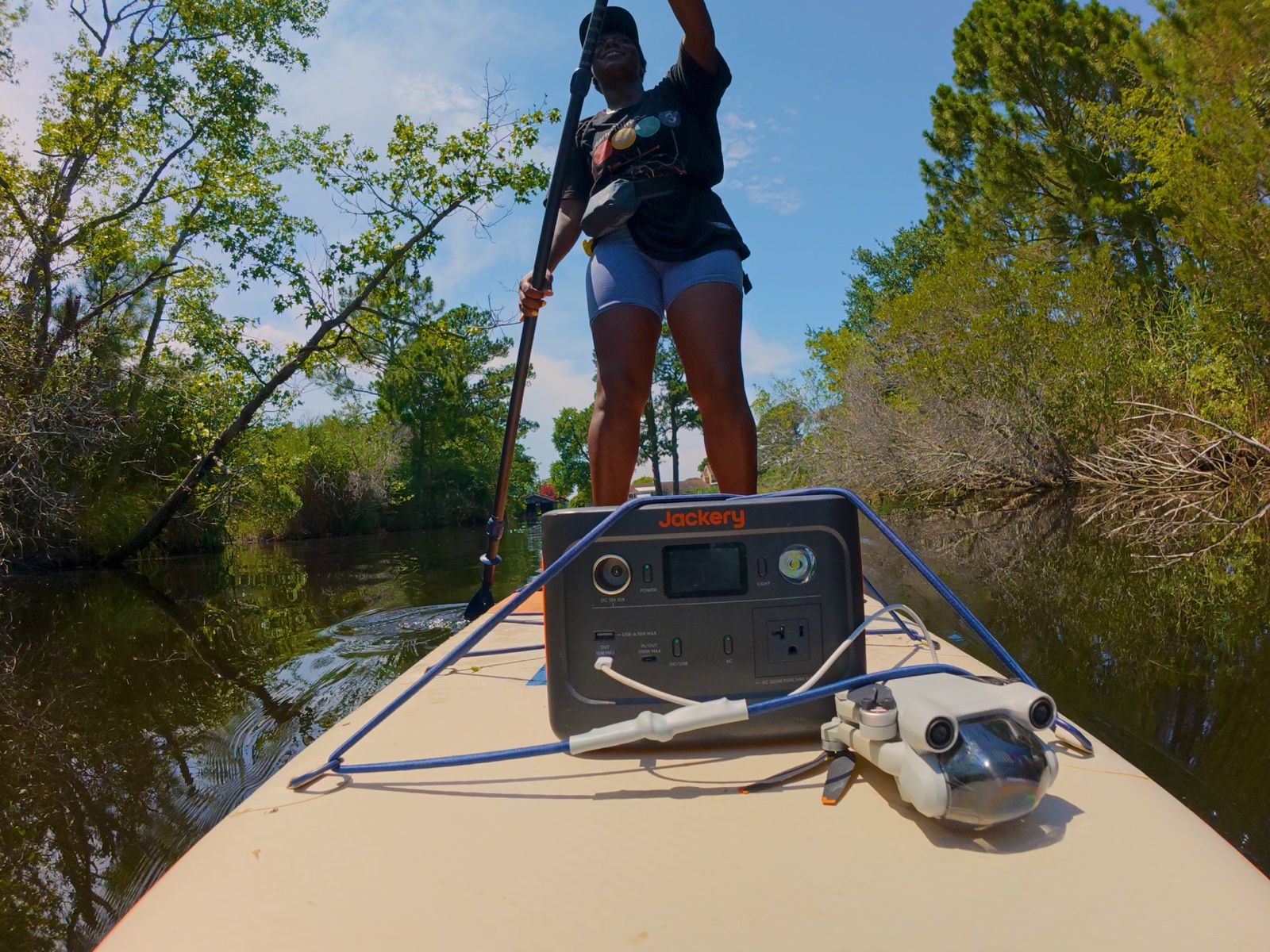 Power station and drone on a paddleboard on a river